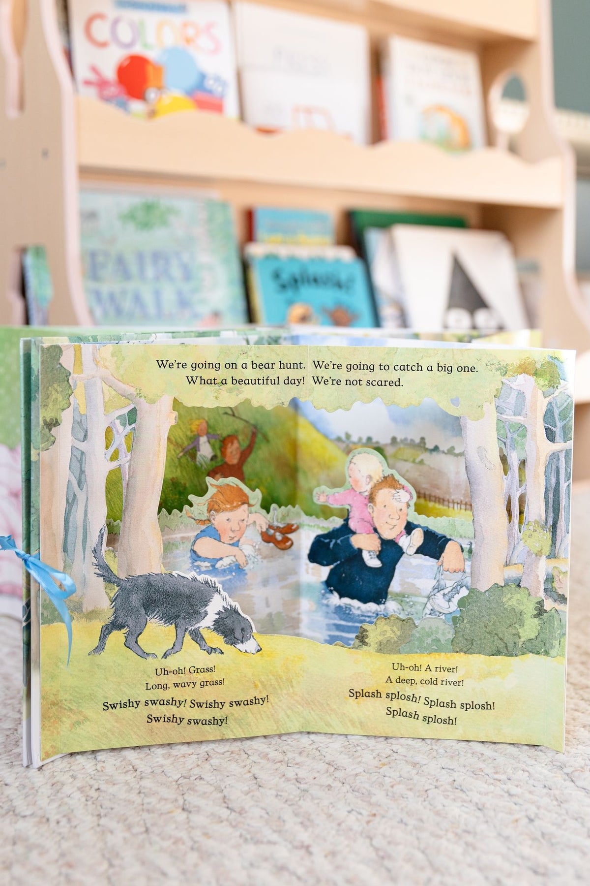 We're Going on a Bear Hunt Pop-Up Carousel Book: (An Interactive Peep-Through Gift Edition with Layered Scenes and Ribbon Tie for Kids Ages 3-7)