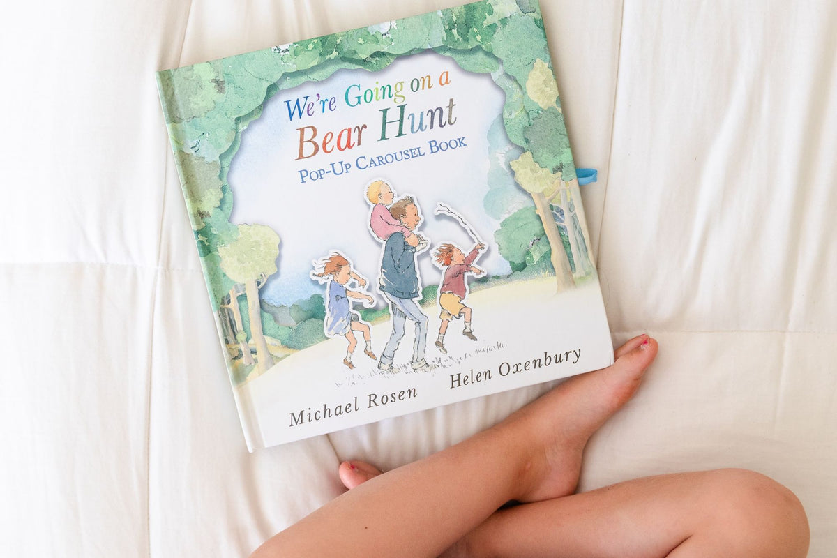 We're Going on a Bear Hunt Pop-Up Carousel Book: (An Interactive Peep-Through Gift Edition with Layered Scenes and Ribbon Tie for Kids Ages 3-7)