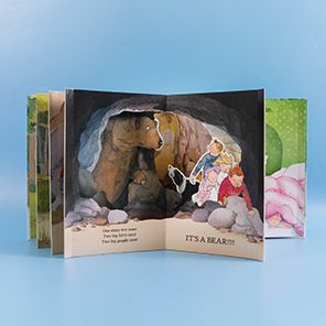 We're Going on a Bear Hunt Pop-Up Carousel Book: (An Interactive Peep-Through Gift Edition with Layered Scenes and Ribbon Tie for Kids Ages 3-7)