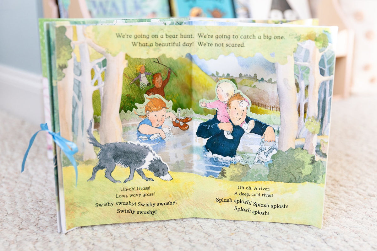 We're Going on a Bear Hunt Pop-Up Carousel Book: (An Interactive Peep-Through Gift Edition with Layered Scenes and Ribbon Tie for Kids Ages 3-7)