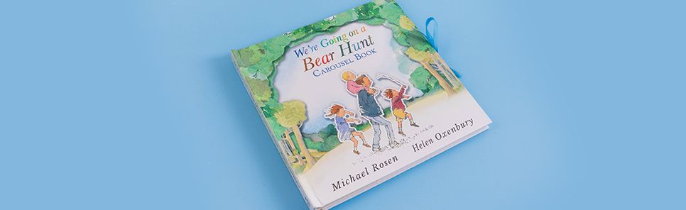 We're Going on a Bear Hunt Pop-Up Carousel Book: (An Interactive Peep-Through Gift Edition with Layered Scenes and Ribbon Tie for Kids Ages 3-7)
