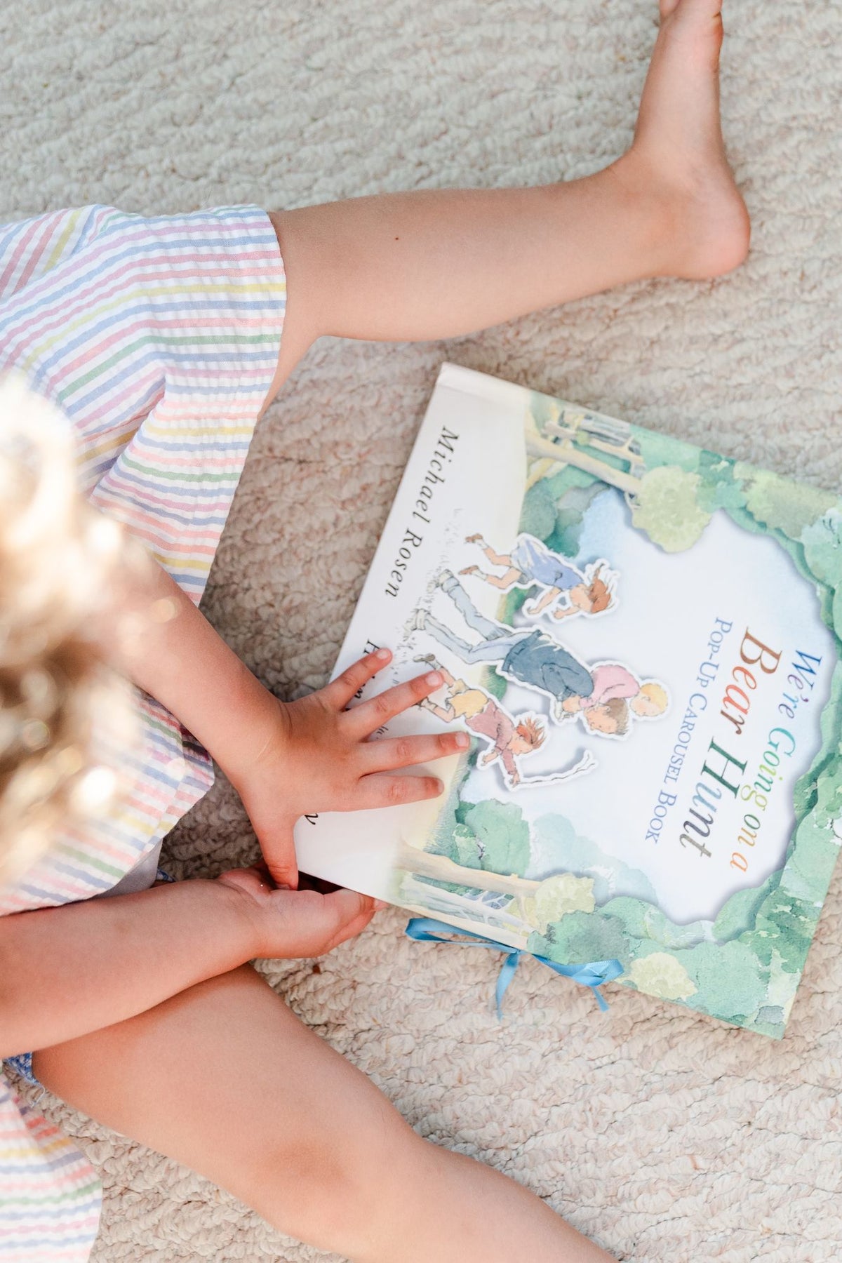 We're Going on a Bear Hunt Pop-Up Carousel Book: (An Interactive Peep-Through Gift Edition with Layered Scenes and Ribbon Tie for Kids Ages 3-7)
